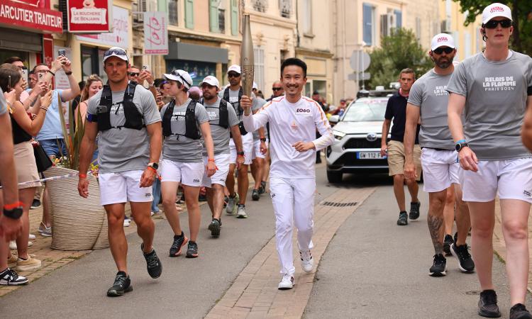 GTE/GT alumnus Louis Chen running in the 2024 Paris Olympics torch relay