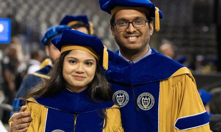 Photo of Irfan Al-Hussaini and Fabia Farlin Athena at the Spring 2024 Georgia Tech commencement.