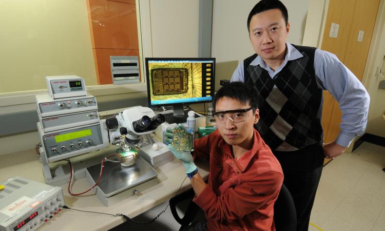 ECE Ph.D. student Taiyun Chi with his advisor Hua Wang