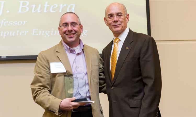 Robert Butera (L), 2016 recipient of the Senior Faculty Outstanding Undergraduate Research Mentor Award with Georgia Tech Provost Rafael L. Bras.