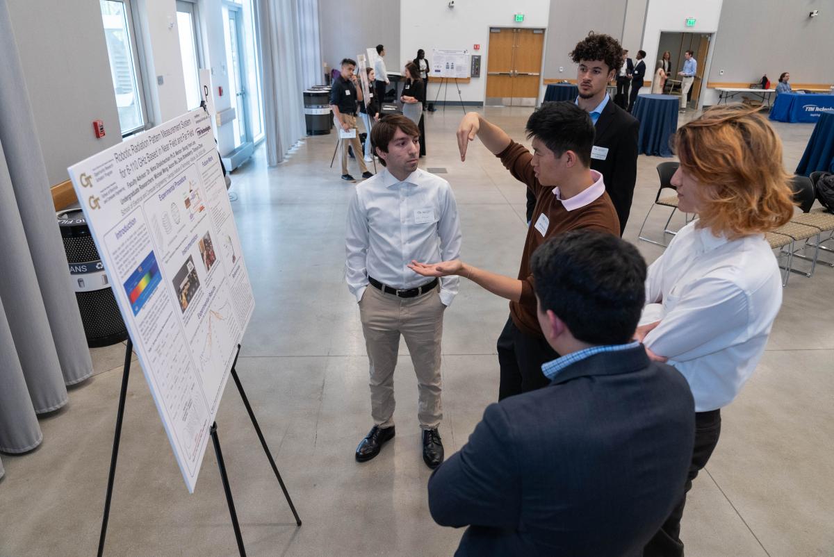 A student at the 2023 Opportunity Research Scholar's (ORS) Symposium demoing his group’s autonomous navigation research project