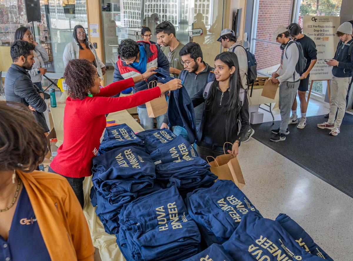 ECE students receiving swag and essentials at pre finals event.