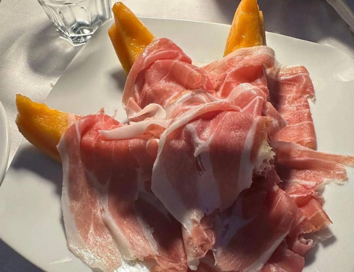 Jennifer's new favorite appetizer; prosciutto e melone - prosciutto ham wrapped around a slice of cantaloupe.