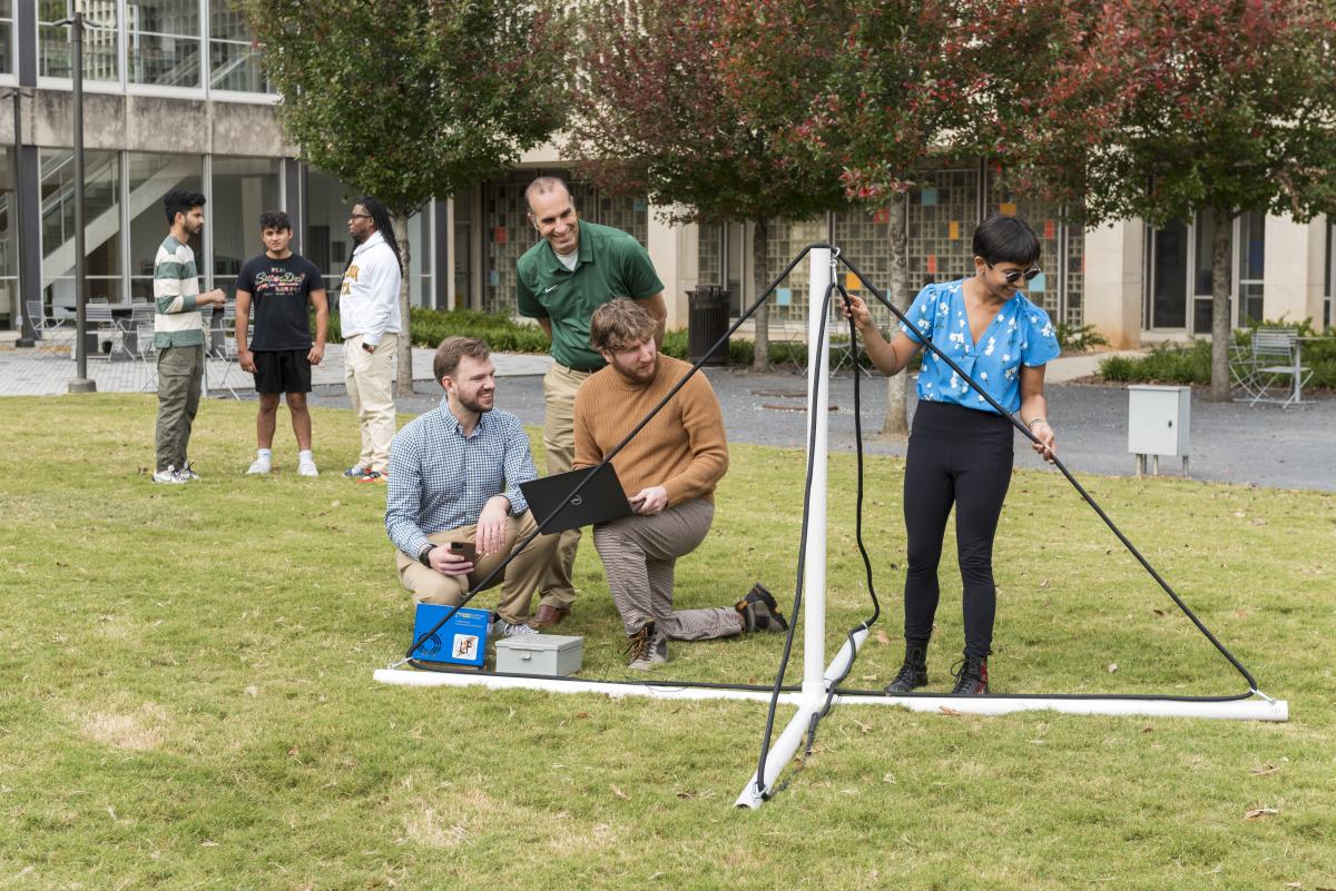 Morris Cohen and his lab students working on a experiment