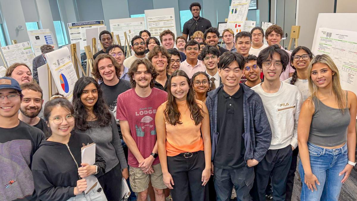 Group of students in the AI Foundations course smiling at the camera