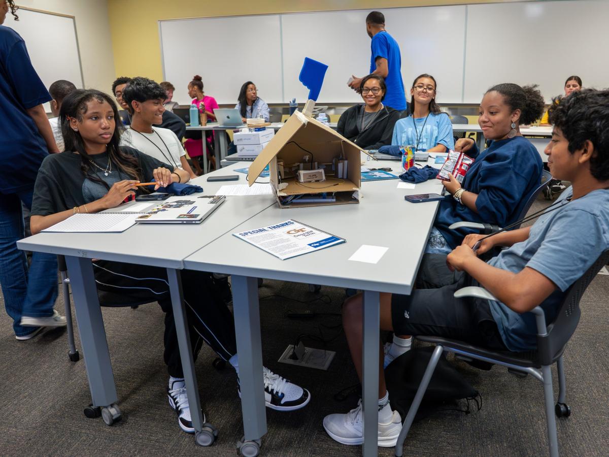 CoSense Camper working on their Arduino powered home security project