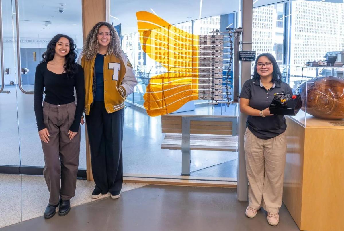 Georgia Tech industrial design students (L- R), Milli Parikh, Kinsey Norton, and Madeline Tran with the Kinetic Butterfly.