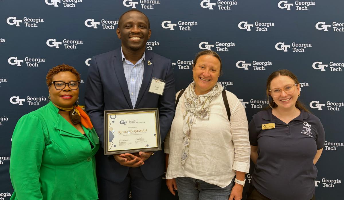 Ph.D. candidate Richard Asiamah receives the 2026 Graduate Student Instructor Award. He is pictured holding the plaque with, from left to right, Tammy M. McCoy, assistant director of TA Development and Future Faculty Initiatives; ECE senior academic professional Daniela Staiculescu, who nominated him for the award; and Bethany Harris, communications program manager for the Center for Teaching and Learning.