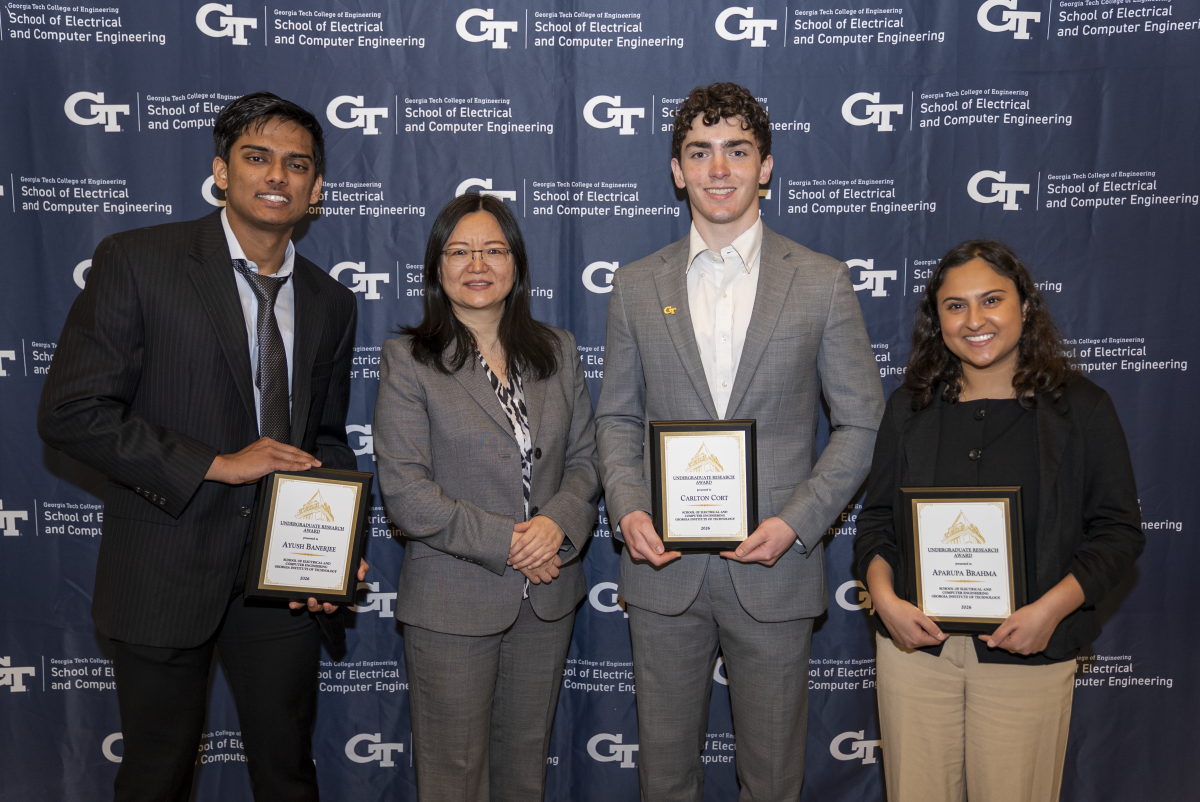 Ayush Banerjee, Aparuna Brahma, and Carlton Cort with ECE Senior Associate Chair Ying Zhang.