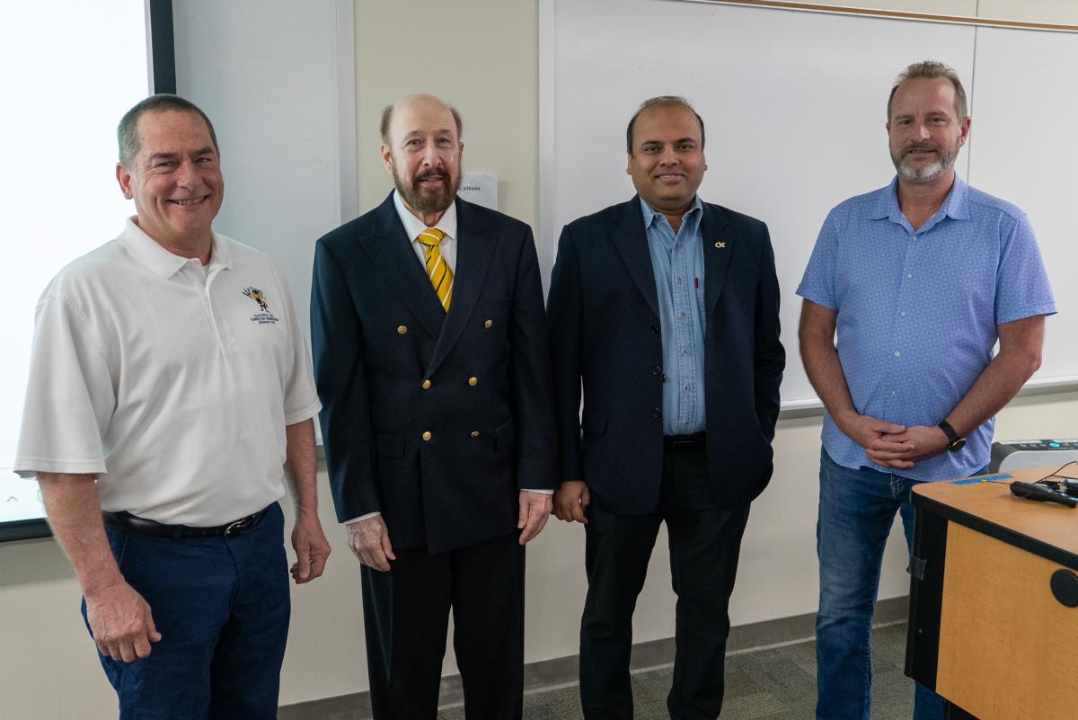 Four men stand side by side in a classroom: Bruno Frazier, Russell Dupuis, Arijit Raychowdhury, and Alan Doolittle.