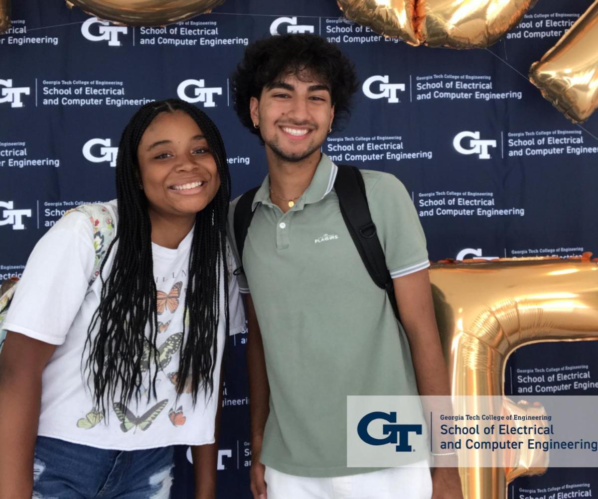 A photo of two students smile for the camera. The photo was taken at the ECE Selfie Booth.