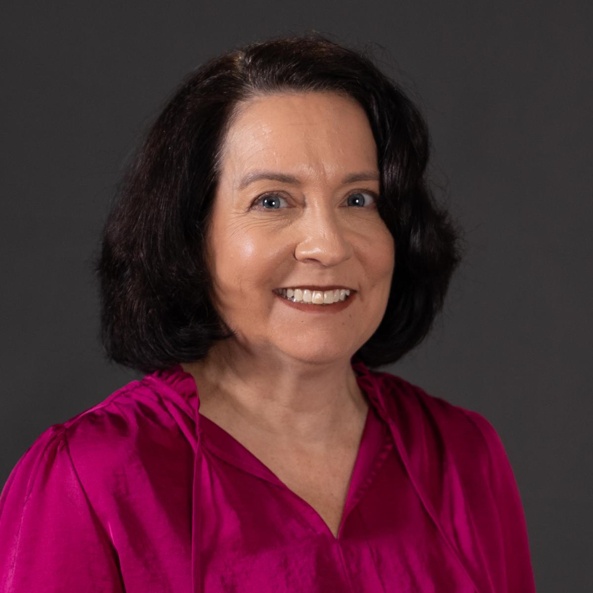 A picture of Caryn Riley smiling