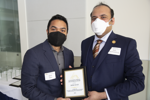 Asim Gazi, ECE Outstanding Service and Outreach Award, 2022 Roger P. Webb Awards Program. Pictured with Arijit Raychowdhury, Steve W. Chaddick School Chair.