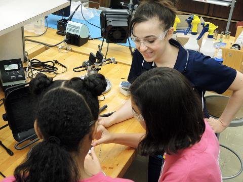 Brittney English and Technology, Engineering, and Computing (TEC) Camp participants.