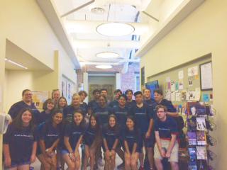 Courtney Hoffman and ENGL 1102 students, summer 2019, in periodic table T-shirts (courtesy of Courtney Hoffman)