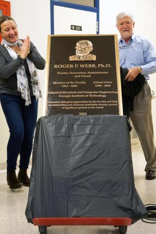 Daniela Staiculescu and Harry Beck alongside plaque