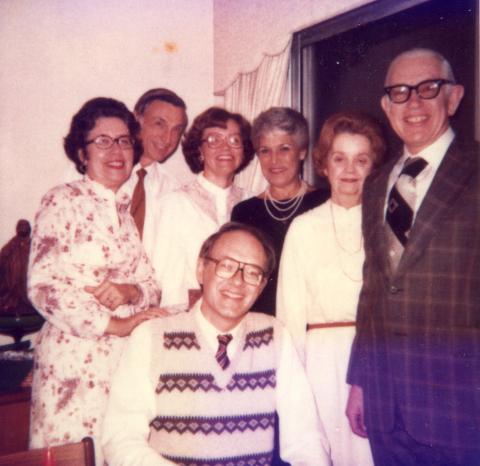 ECE faculty and staff members and spouses enjoy a home social. Standing left to right are Edith Hammond, Joseph Hammond, Jan Gaylord, Jean Shankle Wilson, Gloria White, and Tom White. Sitting is Tom Gaylord.