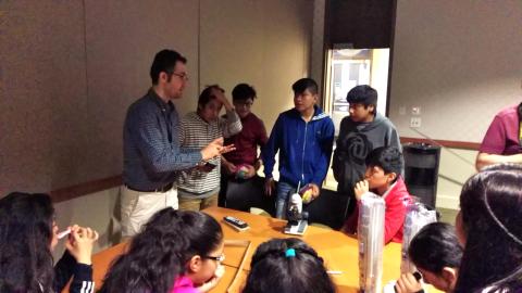 A group of students learn about pixels in backlit devices like smartphones and tablets from Mohammad Taghinejad (far left). A group of students learn about pixels in backlit devices like smartphones and tablets from Mohammad Taghinejad (far left).