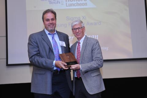 ECE Assistant Professor Omer Inan (left) with Sigma Xi President Paul Kohl 