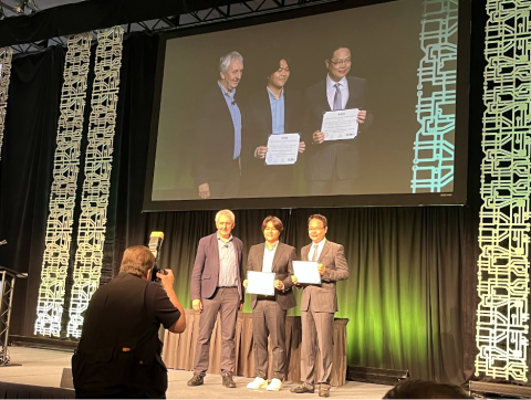 Professor Sung Kyu Lim (right) and his former student Bon Woong Ku (middle) receiving the 2022 Donald O. Pederson Best Paper Award 