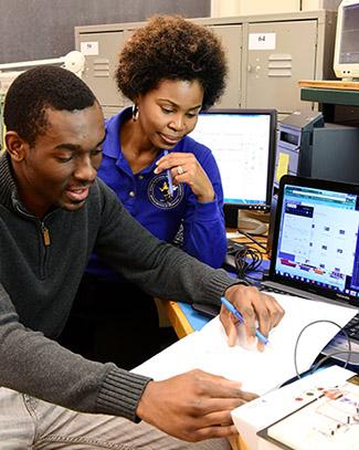 Dr. Joy Harris with electrical engineering major Allen Ndemera from the Camp Twin Lakes team.