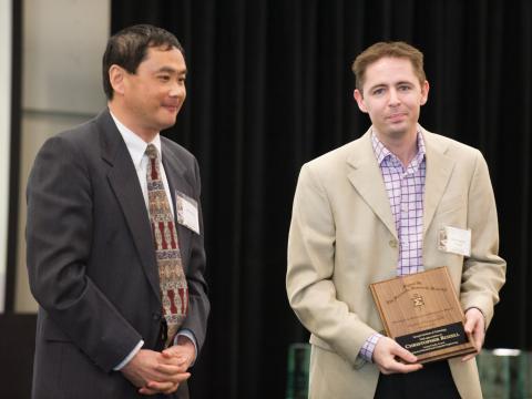 Christopher Rozell with Min Zhou of the Georgia Tech chapter of Sigma Xi