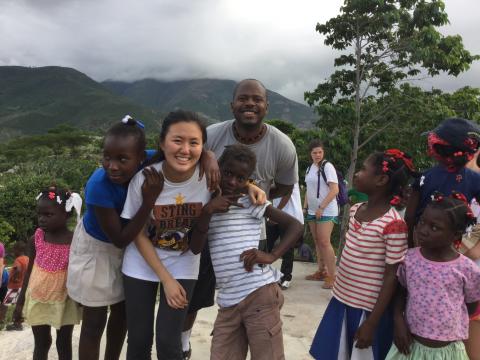 Jiaqing Li and Patrick Pierre hang with the Thoman locals.