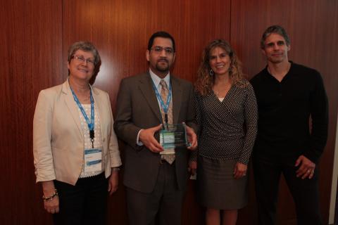 ECE Associate Professor Muhannad Bakir with Intel administrators