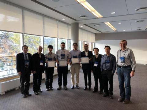 Karan Mehta (4th from right) with ISSLED student award winners and conference organizers