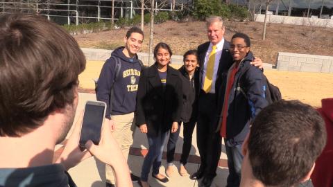 Dr. Peterson greets students