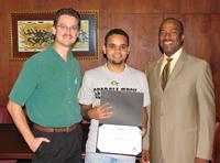 awards presentation photo of Anuj Madan, John Cres