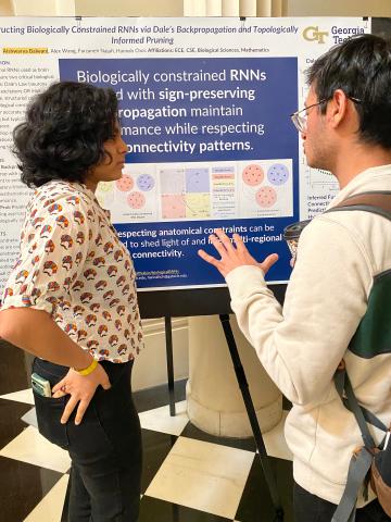 Aishawarya Balwani (on left), a Ph.D. scholar in electrical and computer engineering, answers questions about her research during the Frontiers in Science poster session. Aishawarya Balwani (on left), a Ph.D. scholar in electrical and computer engineering, answers questions about her research during the Frontiers in Science poster session.
