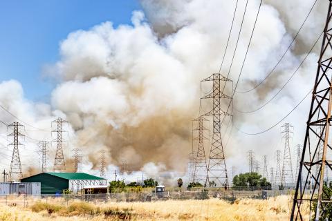Smoke cloud rising from a brush wildfire burning in East San Francisco Bay Area, California