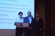 Haohong Wang (right), of TCL Research America and chair of the 10K Best Paper Award competition, recognizes Gukyeong Kwon and ECE Professor Ghassan AlRegib (left and center) for their work as a finalist in the First 10K Best Paper Award competition. 