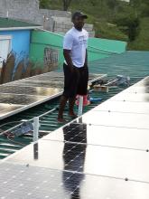 Patrick Pierre on the Thoman health center roof.