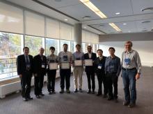 Karan Mehta (4th from right) with ISSLED student award winners and conference organizers