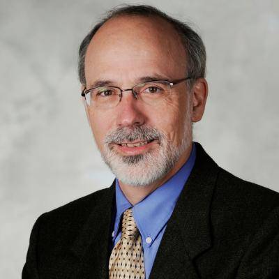 A picture of Thomas R Collins smiling